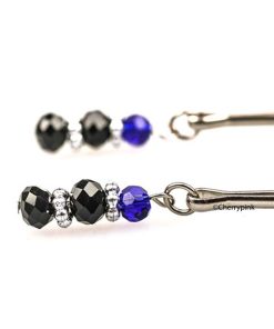 Adjustable Nipple Clamps With Jewellery Hanging From The Clamps