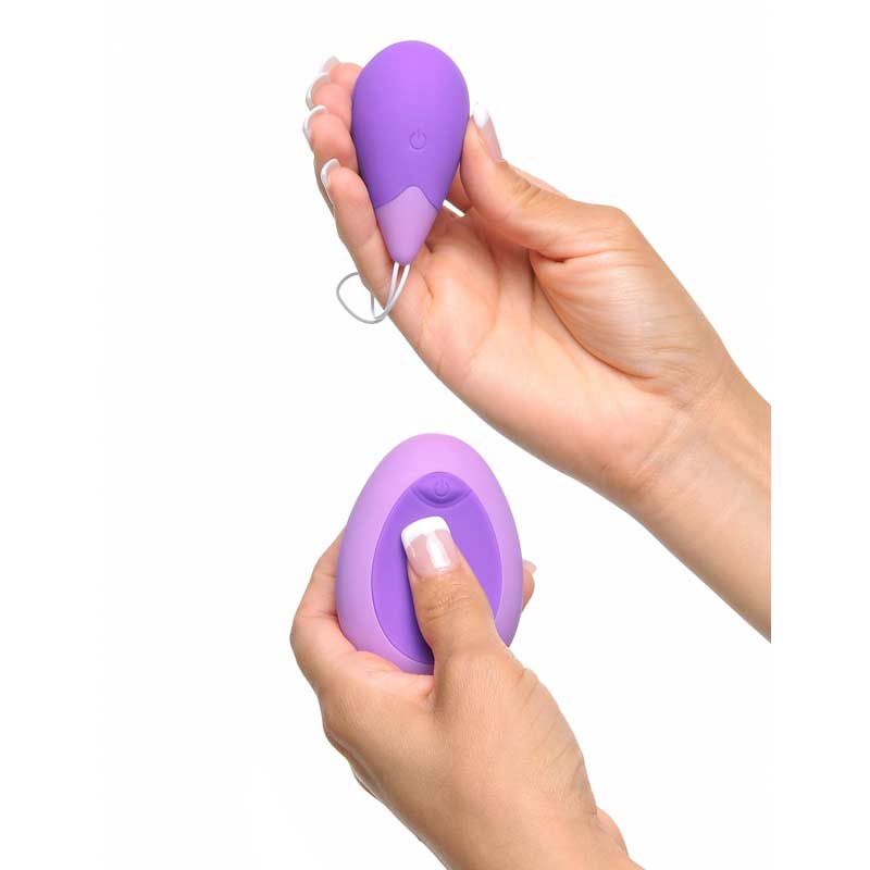 Someone holding the egg and remote