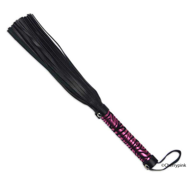 The black Baby Flogger on a White Background.