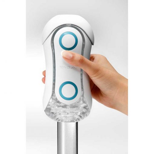 Tenga Flip Orb Blue Rush Masturbator With Someone Pulling it Onto a Glass Dildo