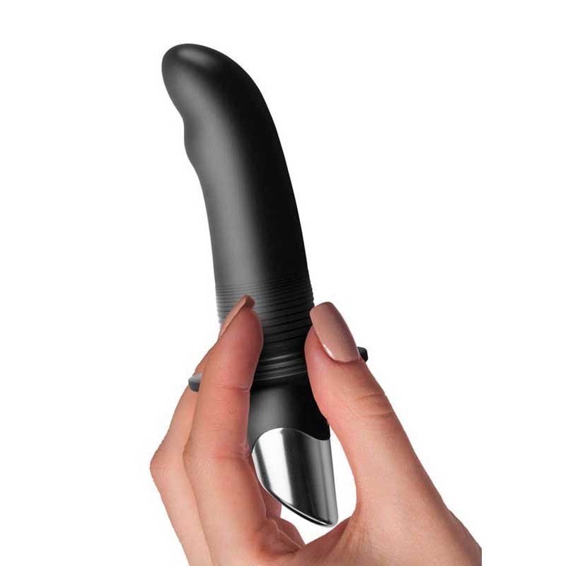 A women's hand holding the vibrator