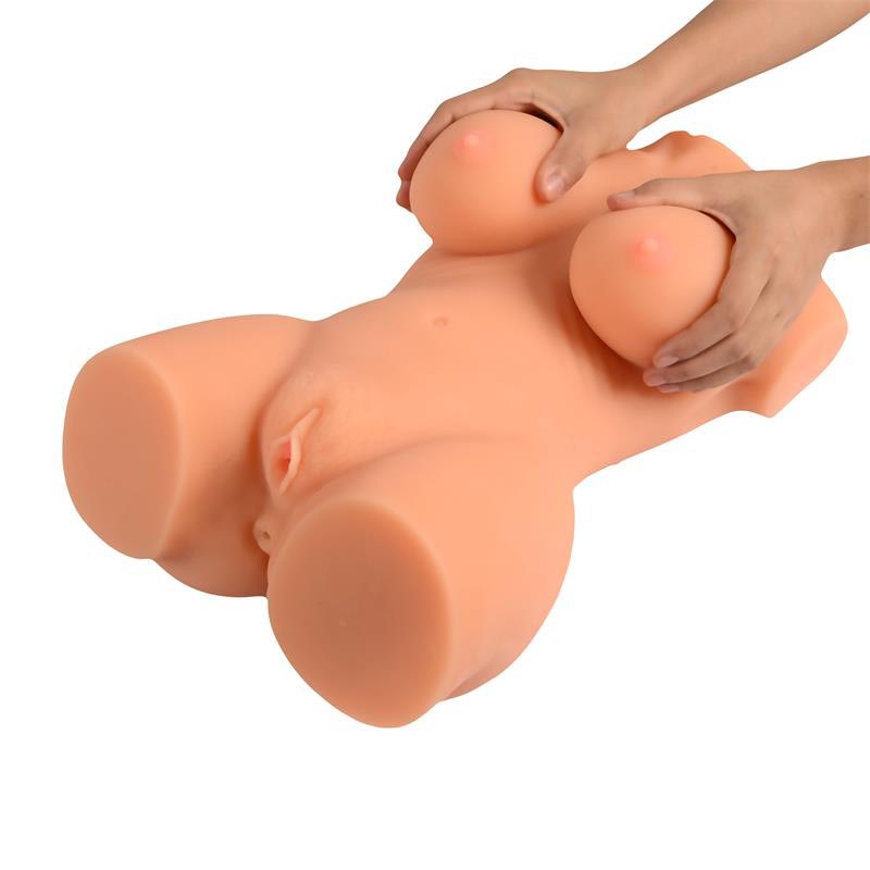 Someone holding the sex dolls breasts