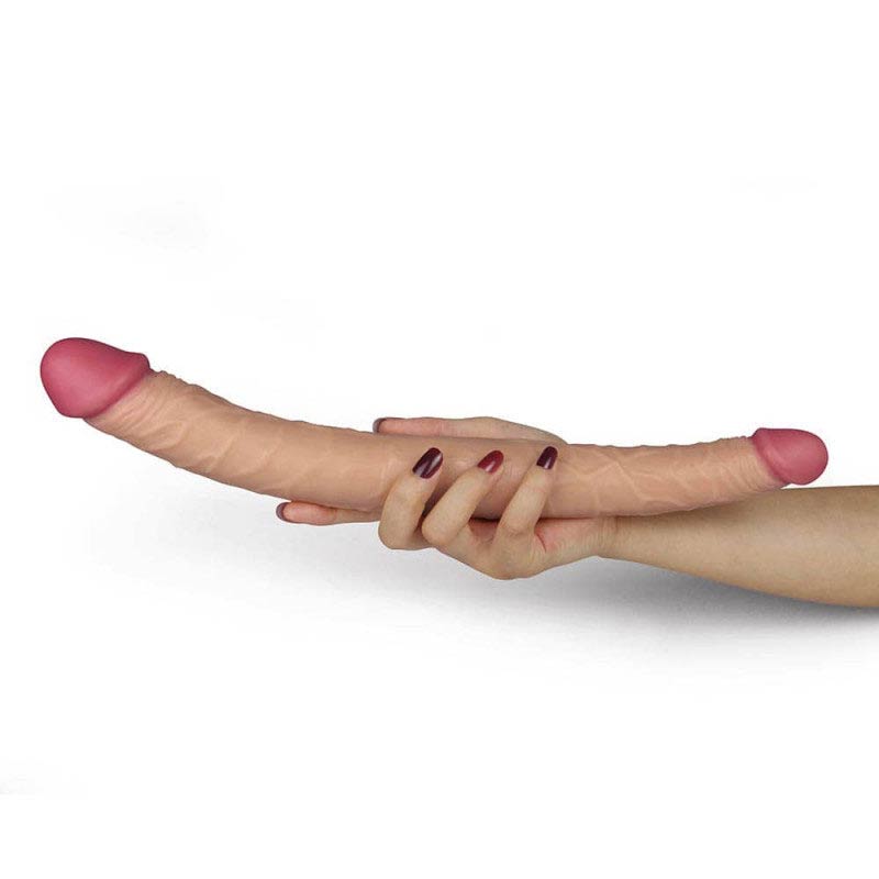 A women holding the double dildo in the middle