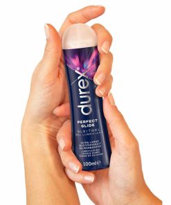 Durex Perfect Glide Lubricant 100ml bottle in a pair of hands.