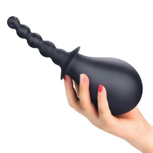 bondage fetish deluxe silicone douche enema in a women's hand
