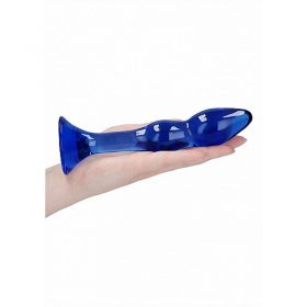 The glass dildo on the palm of a women