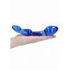 The unisex blue glass dildo on the palm of a women's hand