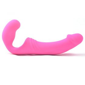 Double Rider Strapless Strap-On Pink Dildo Sitting On A White Background.