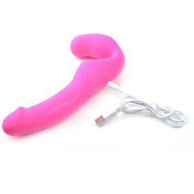 Double Rider Strapless Strap-On from the side with its USB charging cable inserted into it.