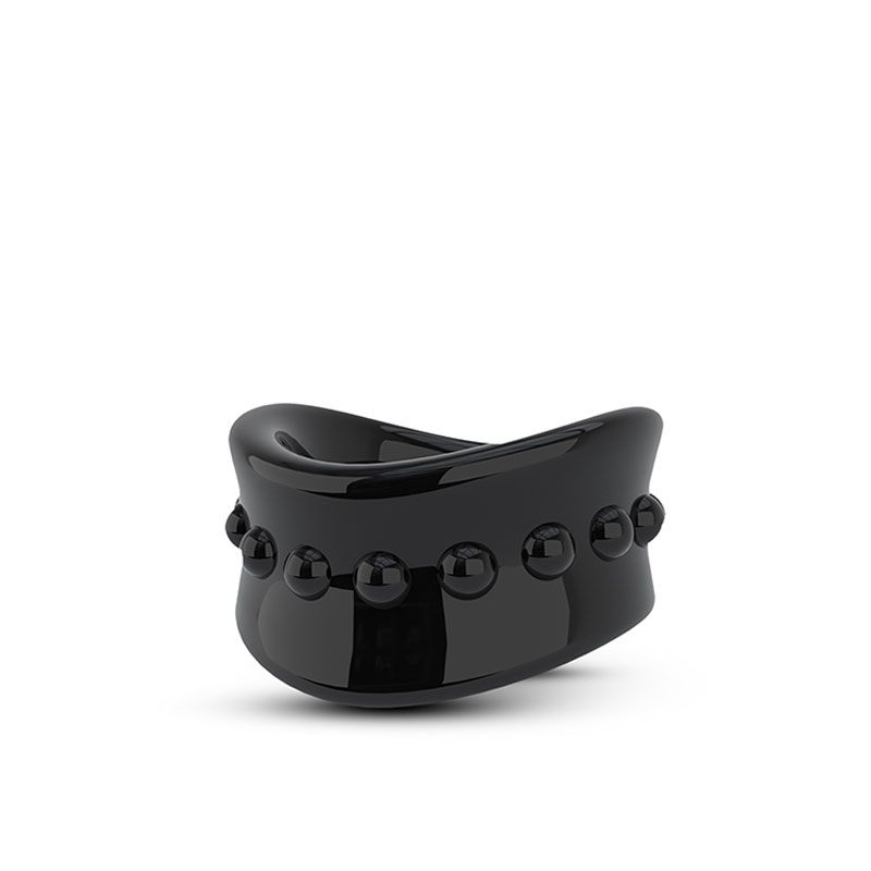 Black rubber stay hard testicle stretcher on a white background