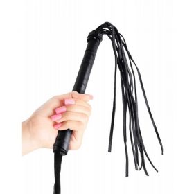 The beginners black whip in the hand of a women