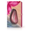 The Womanizer Liberty Clitoral Vibrator in its pink and red display box