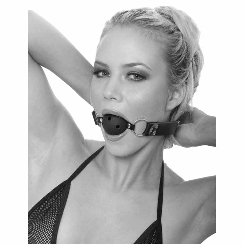 A pretty women wearing the black ball gag in her mouth