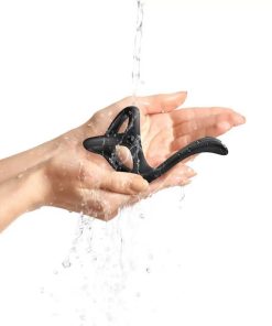 3 in 1 Cock Ring with Taint Teaser in hands under running water.