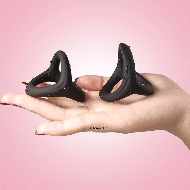 3-in-1 Ultra Soft Cock Ring Black in a womens hand