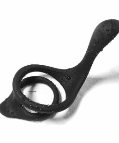 The Black Silicone Dual Penis Ring with Splashes of Water on it.