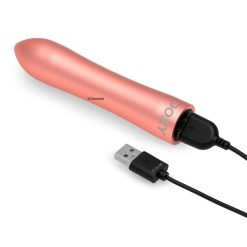 A small ping clitoral stimulator with it's rechargeable cable plugged in.