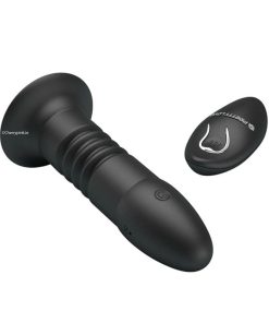 The front and tip of the anal sex toy with its remote control beside it