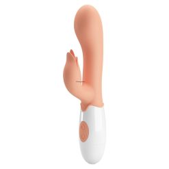 The front of the flesh coloured vibrator standing on a white background