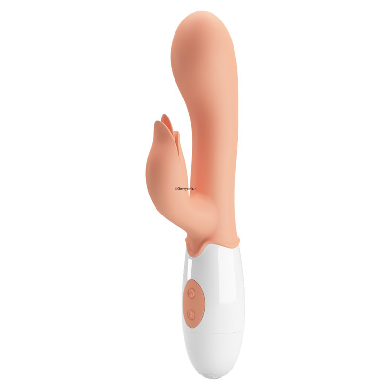The front of the flesh coloured vibrator standing on a white background