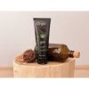 The Lube Tube Cannabis Orgie Gel standing on a wooden block
