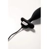 The Je Joue Onyx Vibrating Butt Plug Plugged in With Its USB Charger