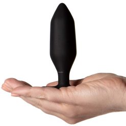 The butt plug in the palm of a persons hand