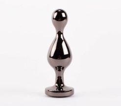 X-MEN Secret Shine Large Metal Booty Call Butt Plug Standing on a White Background