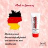 A tube of hot super glide lube standing with a map of Germany and some information written beside it