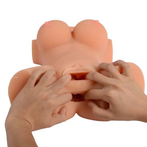 Male hands showing the inside texture of the sex toy doll