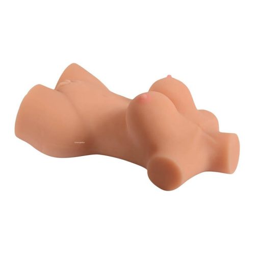 The sex toy doll lying on its side