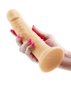 The Colours Pleasures'7-inch Vibrating White Dildo in a Women's Hand