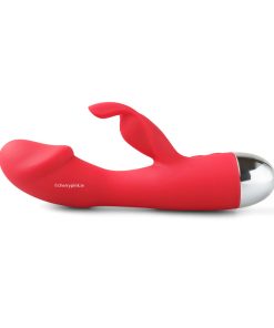 The red vibrator lying on its back on a white background