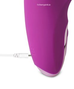 The vibrator with its charging cable plugged into it