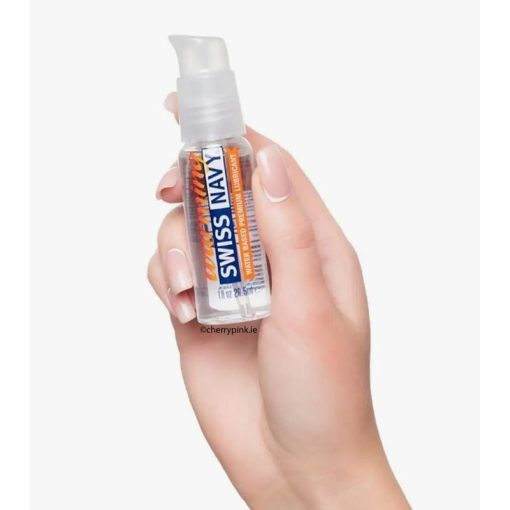 Swiss Navy Warming Lubricant 29.5 ml in a Women's Hand