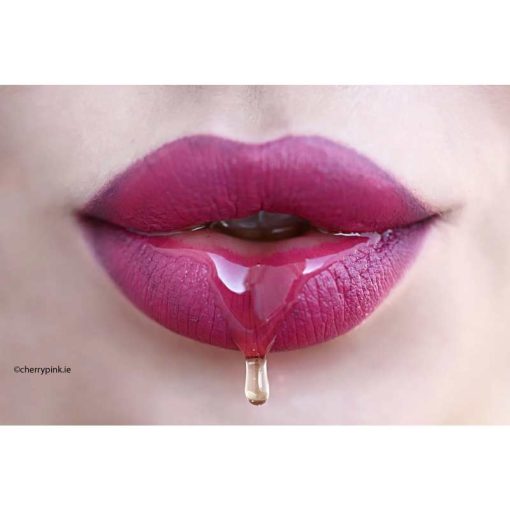 Lick It Erotic Massage Oral Gel on a Women's lips