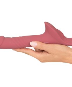 The Vibrating Dildo From The Strap-On Harness Set With Thrusting Vibrator in a Women's Hand