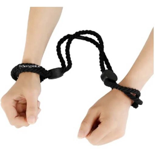 Adjustable Black Polyester Bondage Handcuff Rope on a Women's Wrists